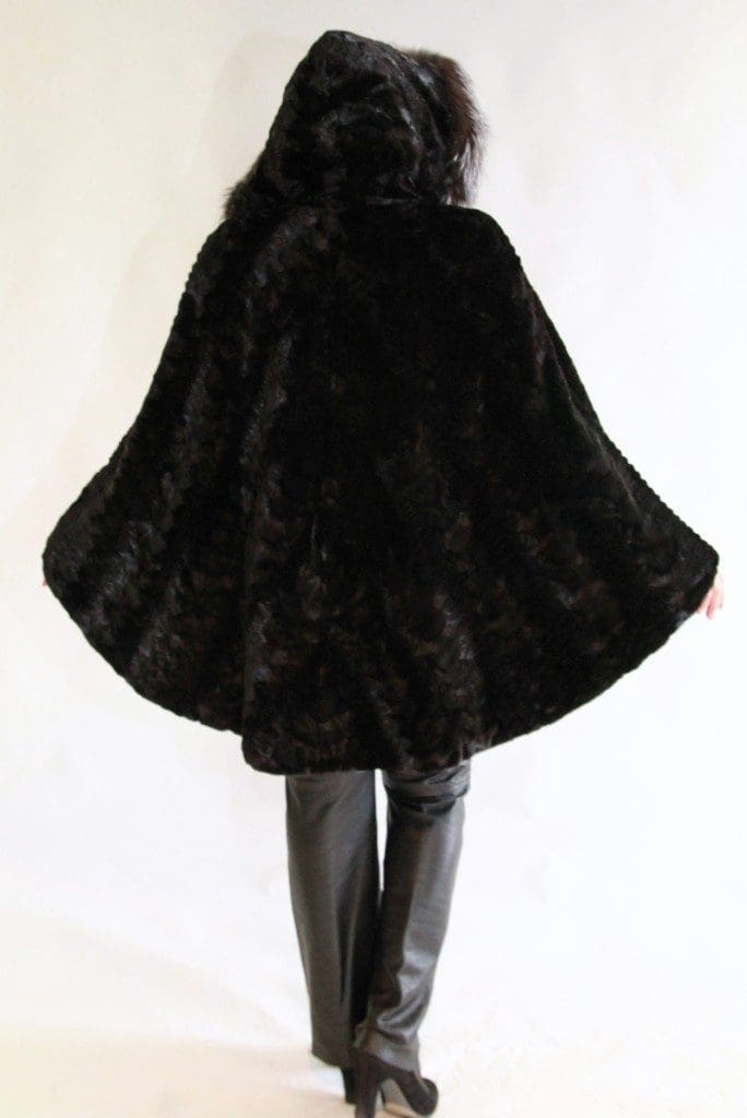 black sheared mink sections 36 chevron design with grooving detail cape parka and indigo fox trim around the hood3